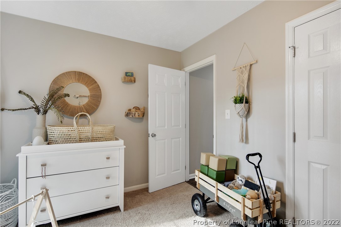 7096 Rockfish Road Raeford, NC 28376 - Photo 33 of 40 a room with a table and a mirror