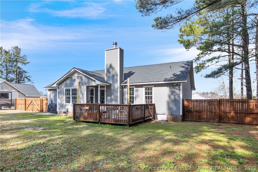 7096 Rockfish Road Raeford, NC 28376 - Photo 36 of 40 a front view of a house with garden