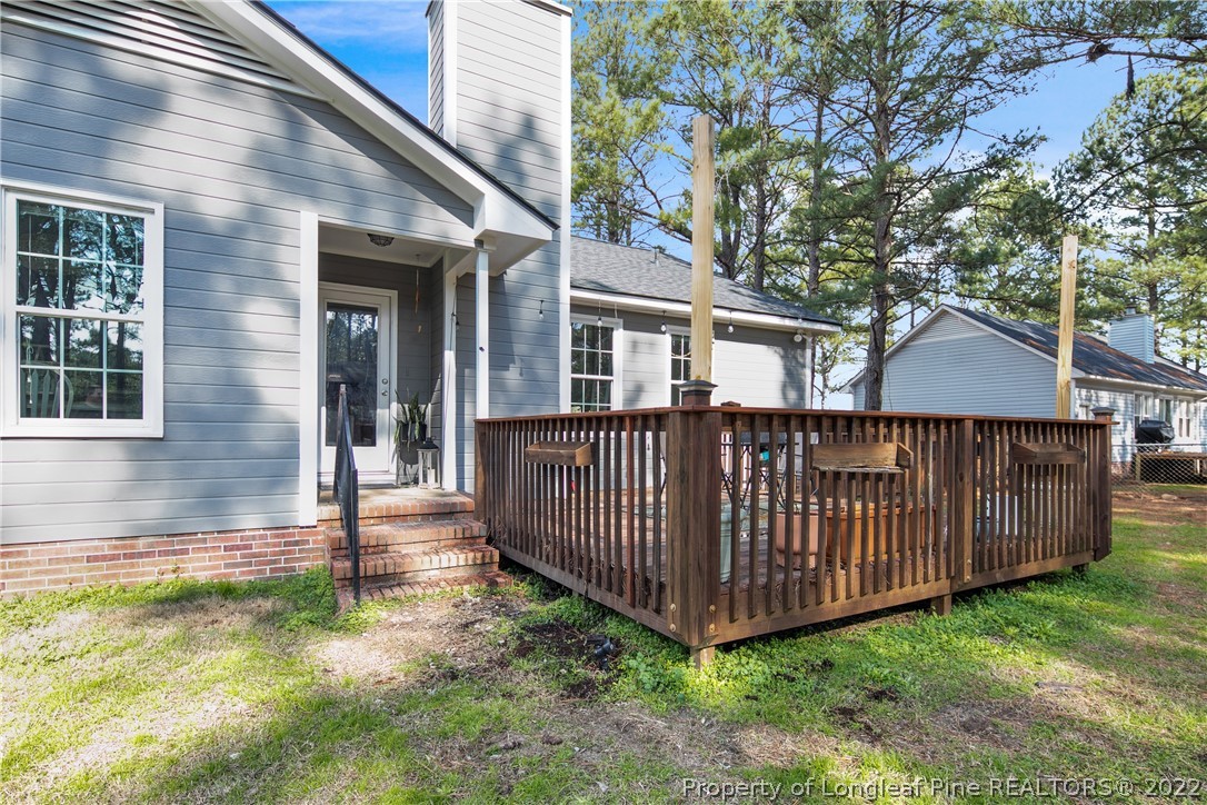 7096 Rockfish Road Raeford, NC 28376 - Photo 38 of 40 a view of backyard with deck and garden