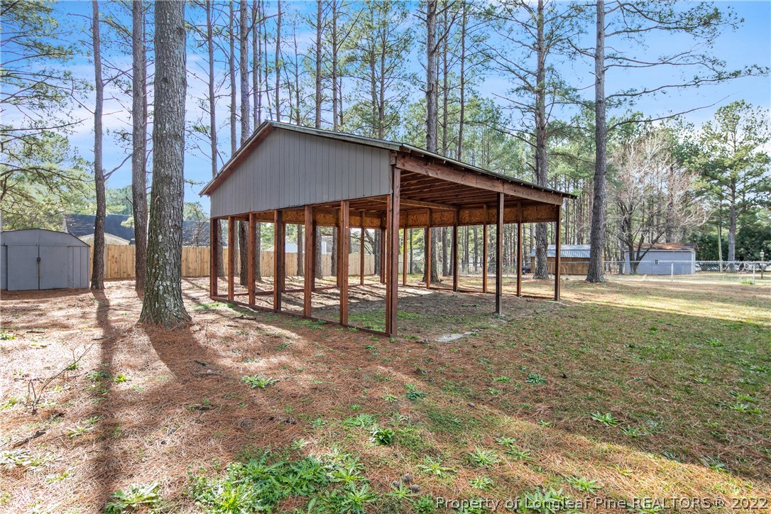 7096 Rockfish Road Raeford, NC 28376 - Photo 40 of 40 a backyard of a house with table and chairs