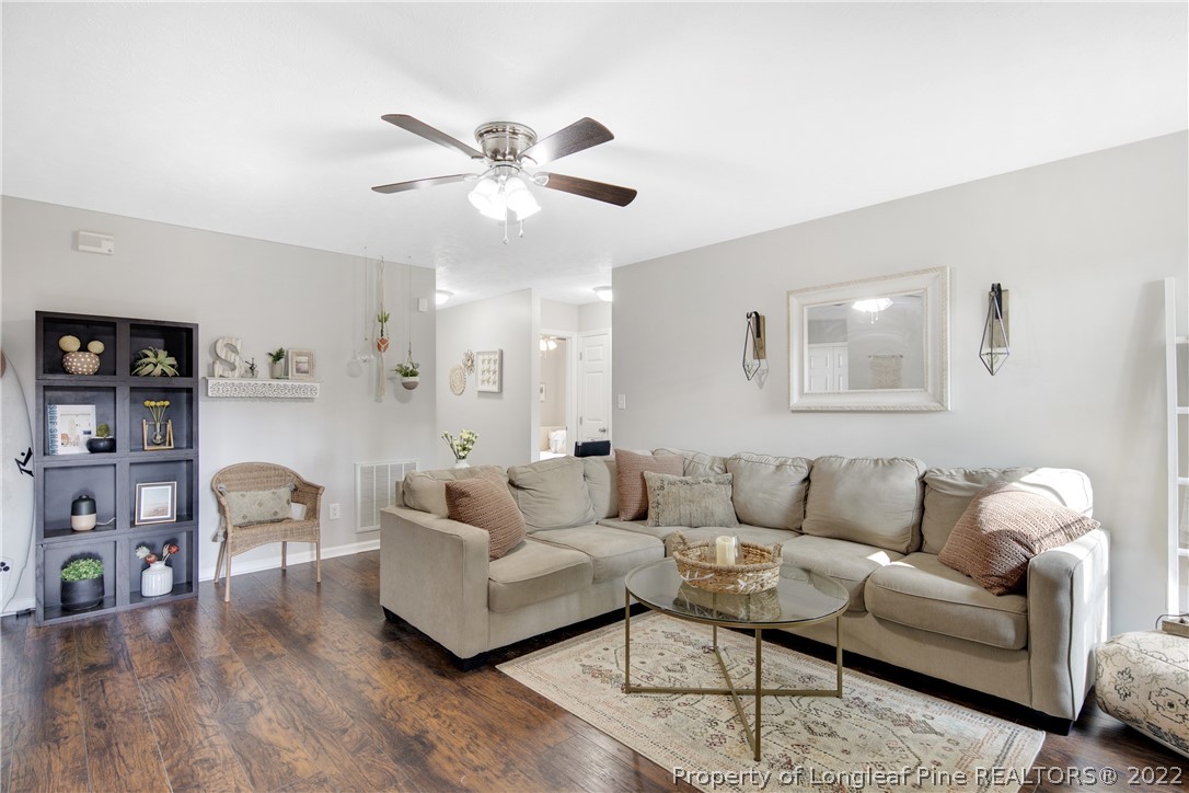 7096 Rockfish Road Raeford, NC 28376 - Photo 10 of 40 a living room with furniture and wooden floor