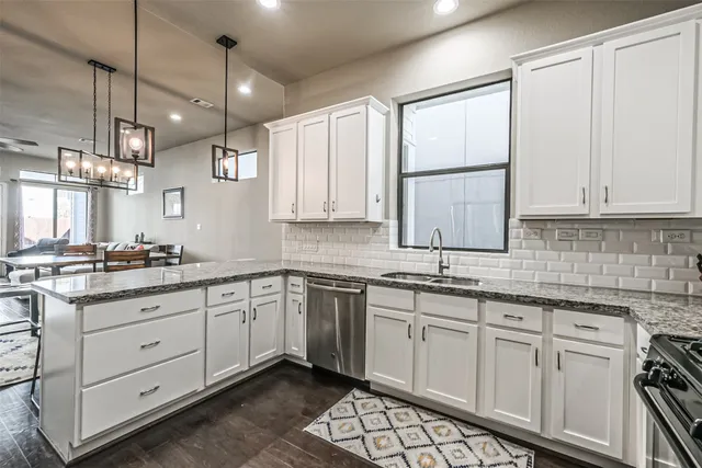 a kitchen with a sink stove and cabinets