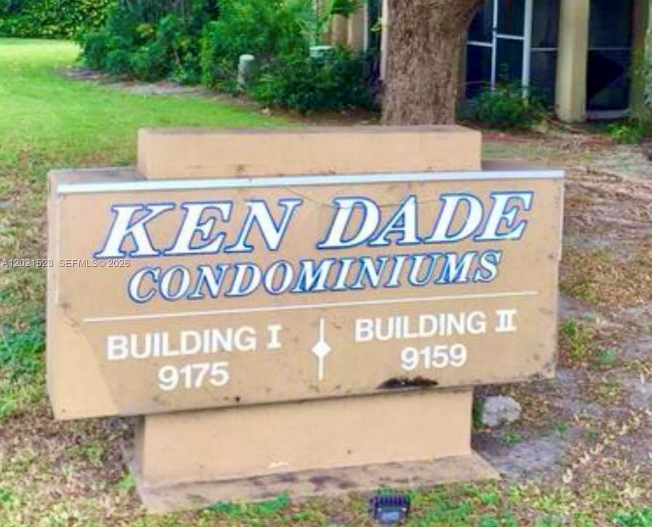 9159 Southwest 77th Avenue, Unit 101 Miami, FL 33156 - Photo 3 of 12 a sign on the side of a building