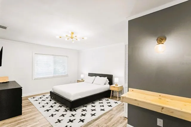 a living room with furniture fireplace and a large window