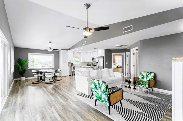 a kitchen with sink stove and refrigerator