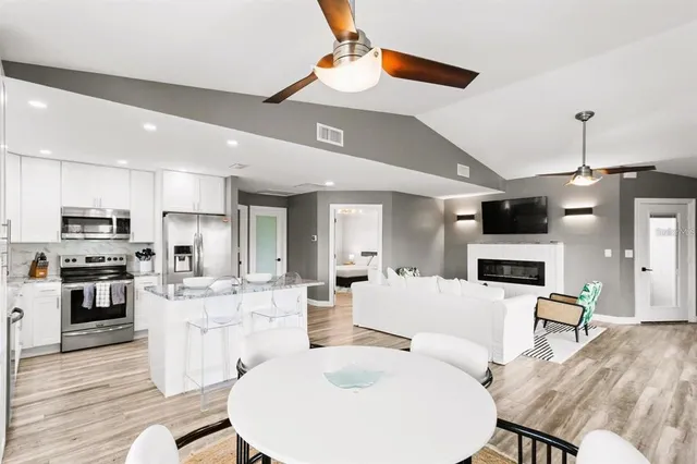 a kitchen with a sink stove and cabinets