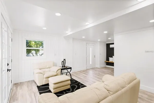 an aerial view of a house with a garden and lake view