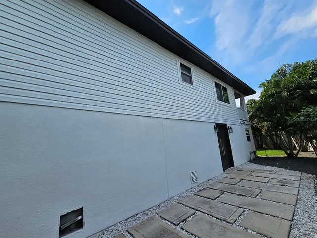 a house view with a garden space