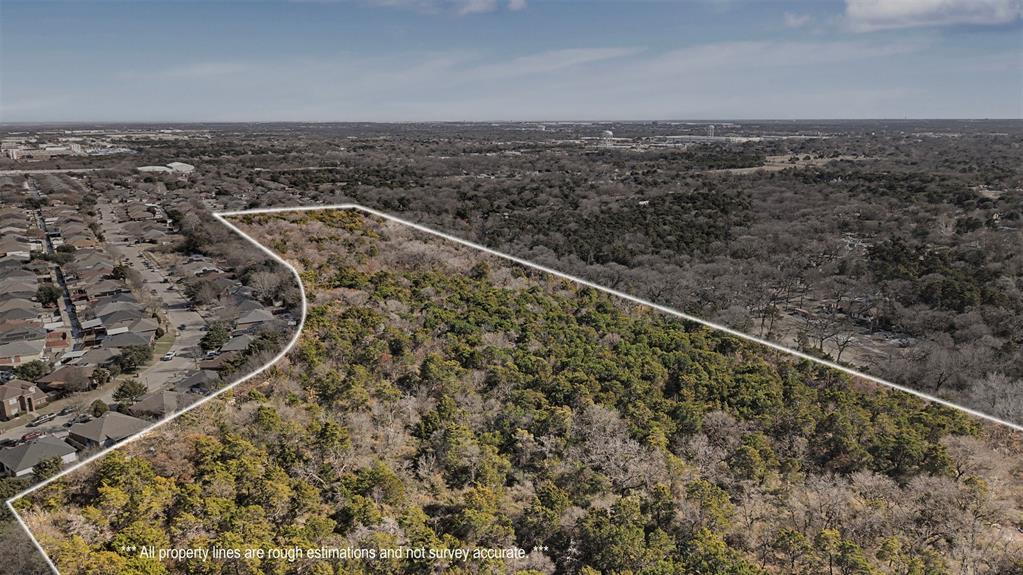 an aerial view of house with yard