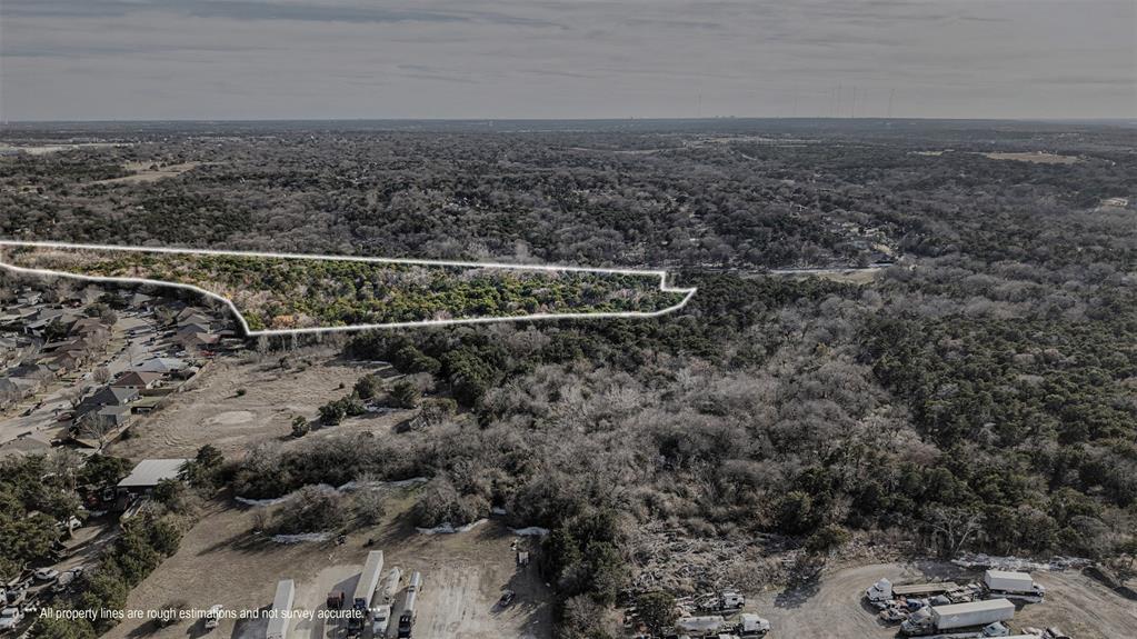 4601 Duncanville Road Dallas, TX 75236 - Photo 8 of 18 an aerial view of house with yard and mountain view in back