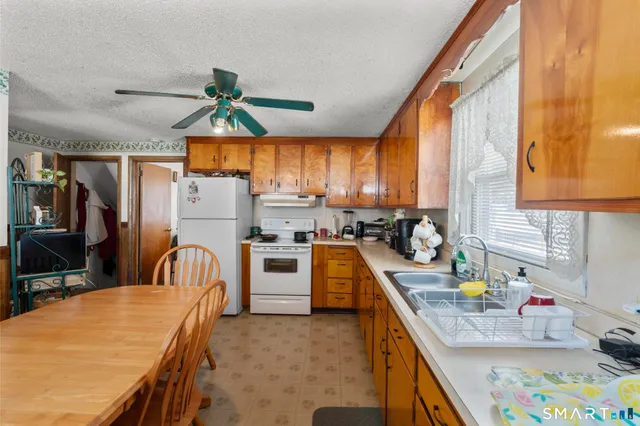 a bathroom with a sink toilet and a mirror