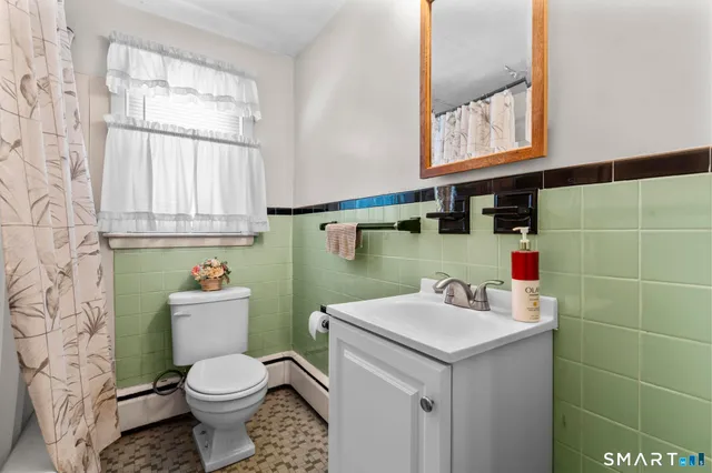 a living room with furniture or couch and a flat screen tv