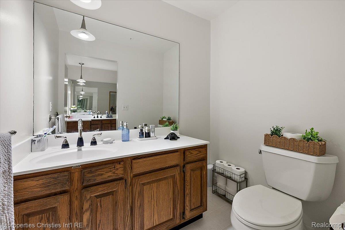 1830 Lone Pine Road Bloomfield Hills, MI 48302 - Photo 25 of 49 Bathroom featuring vanity and light tile patterned floors