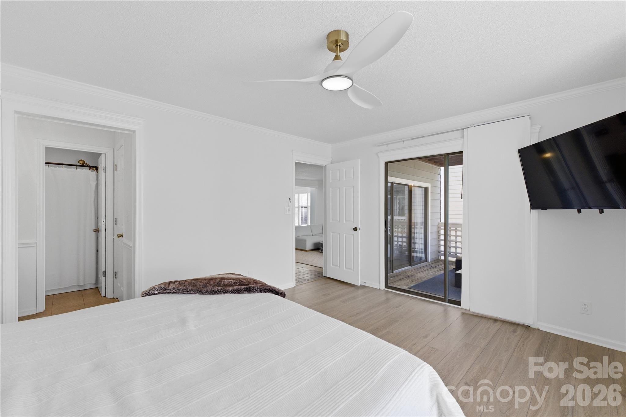 308 Queens Road, Unit 32 Charlotte, NC 28204 - Photo 15 of 30 a bedroom with a bed and a flat screen tv