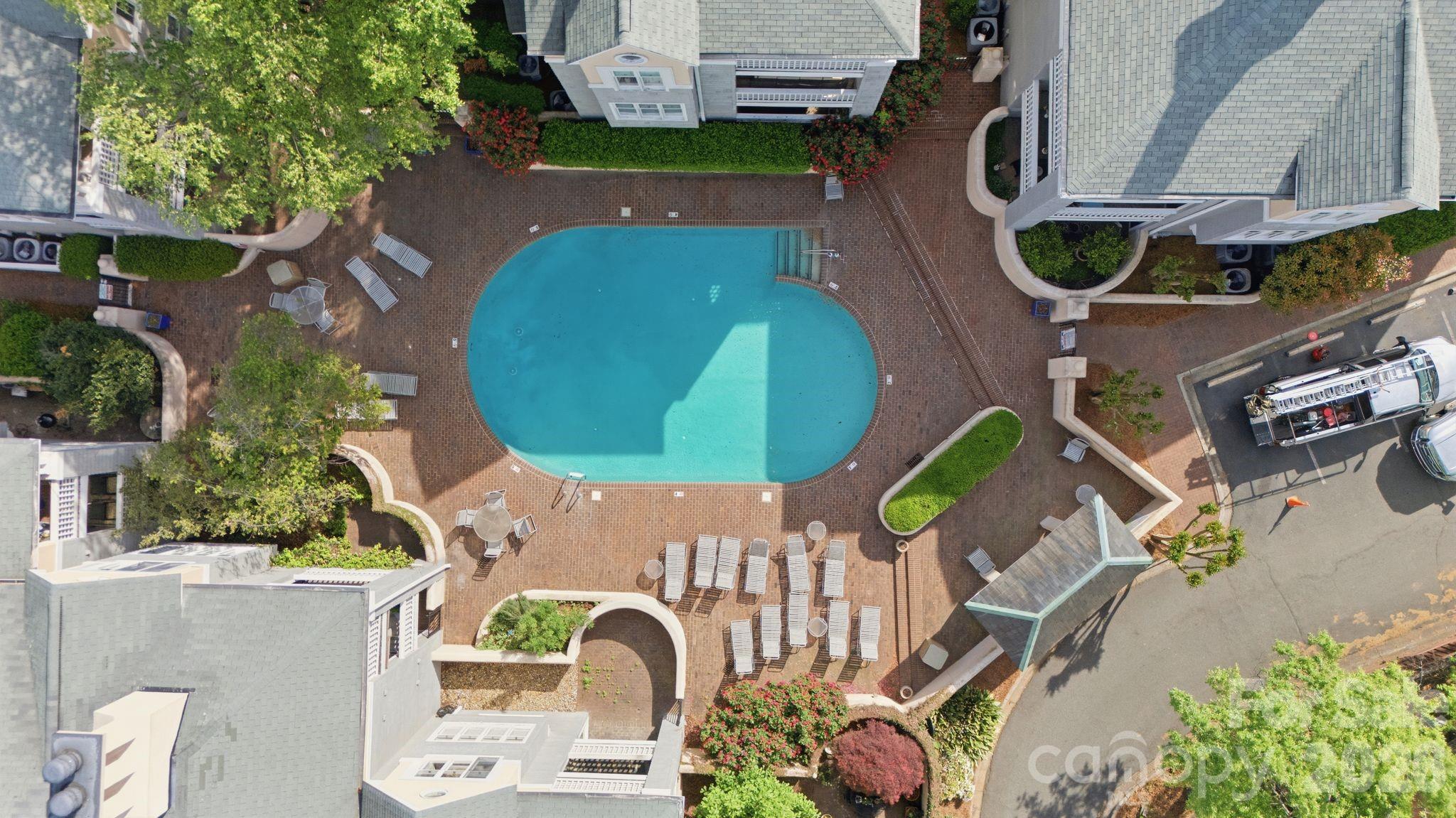 308 Queens Road, Unit 32 Charlotte, NC 28204 - Photo 24 of 30 an aerial view of a house with a swimming pool and outdoor space