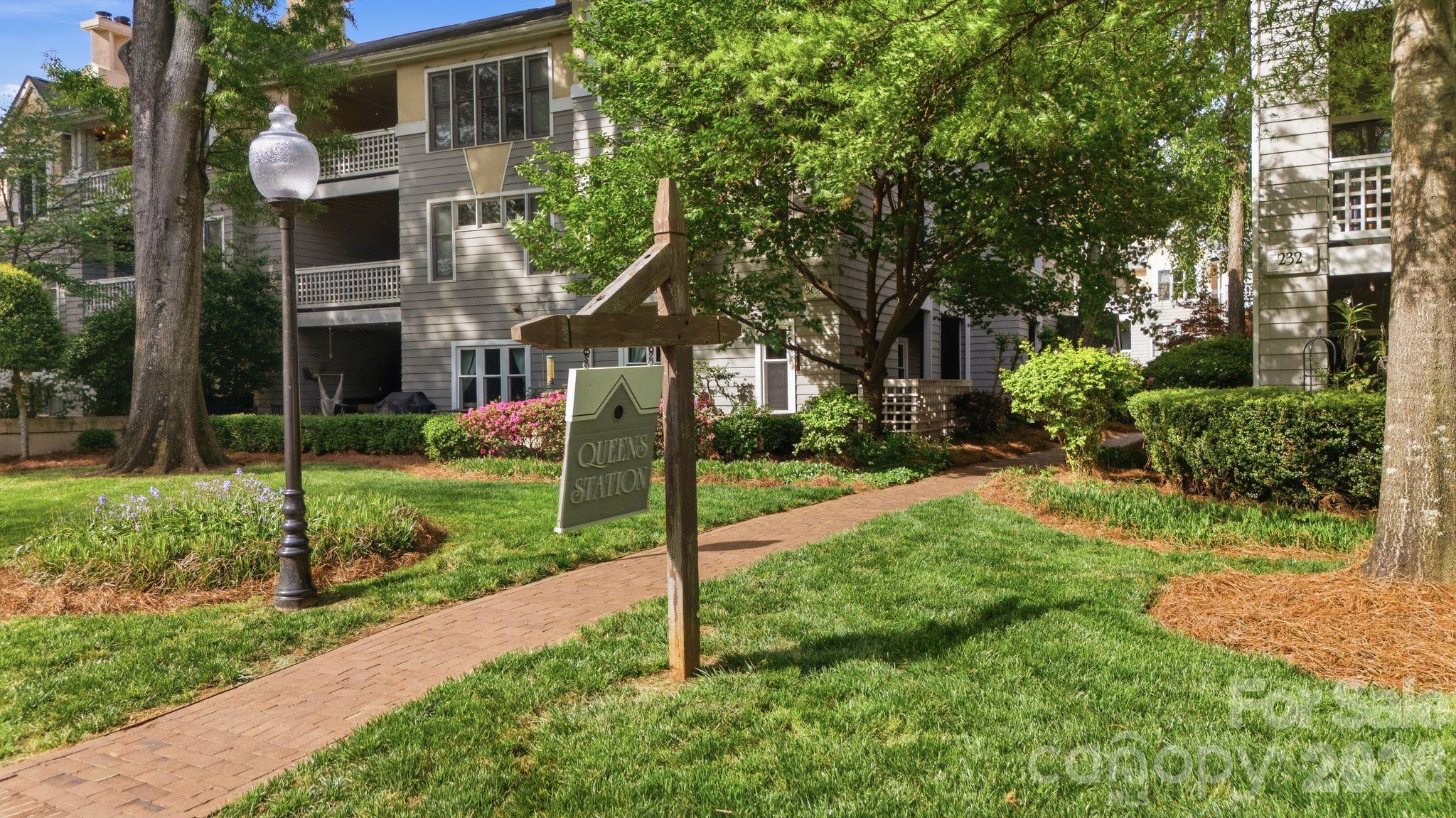 308 Queens Road, Unit 32 Charlotte, NC 28204 - Photo 27 of 30 a view of a house with backyard and garden