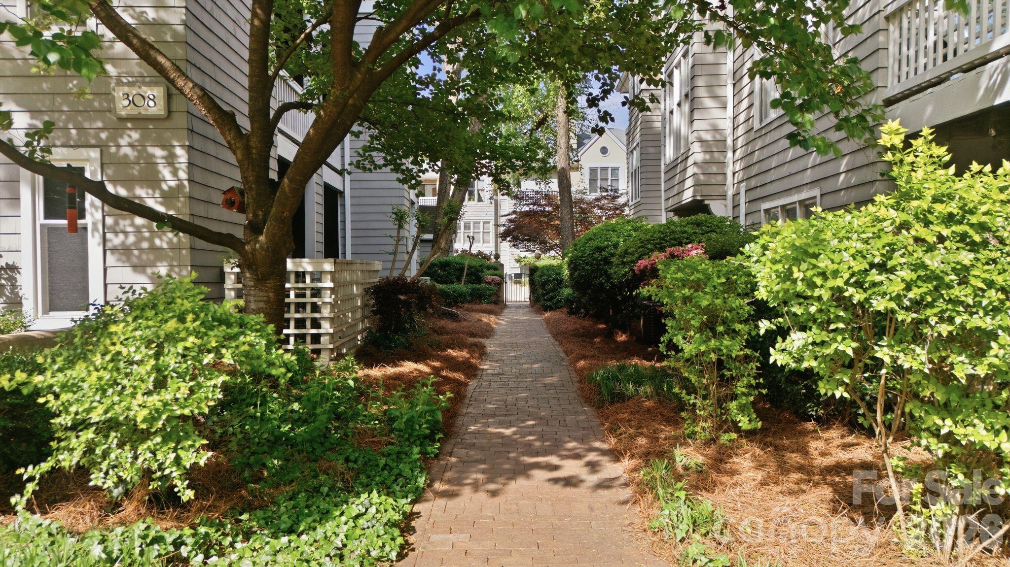 308 Queens Road, Unit 32 Charlotte, NC 28204 - Photo 28 of 30 a view of yard with flower plants