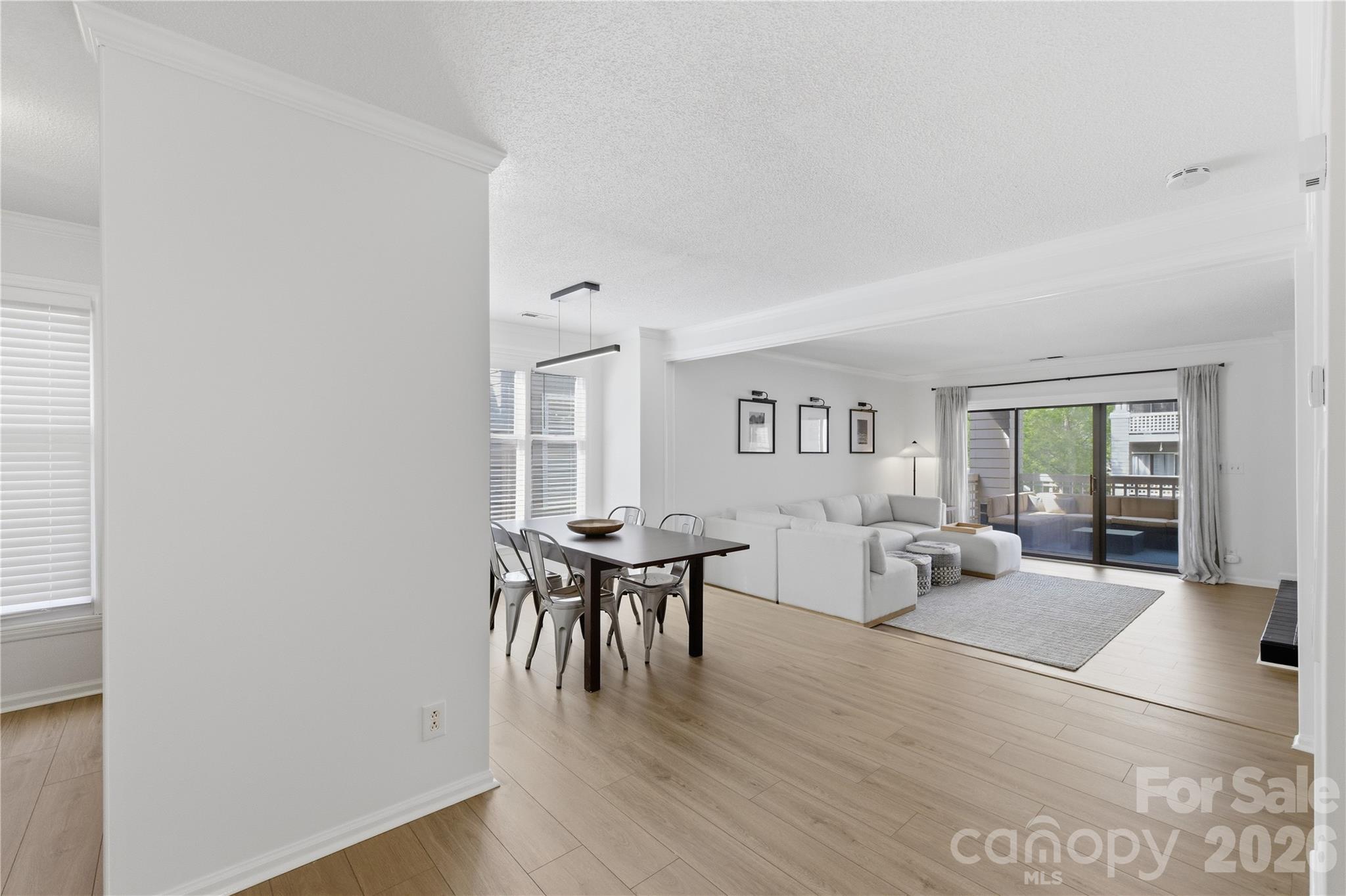 308 Queens Road, Unit 32 Charlotte, NC 28204 - Photo 3 of 30 a view of a livingroom with furniture and wooden floor