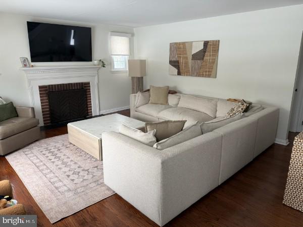 307 Candlewood Road Broomall, PA 19008 - Photo 2 of 18 a living room with a couch a flat screen tv and a fireplace