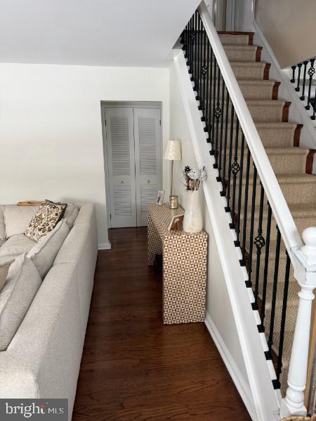 307 Candlewood Road Broomall, PA 19008 - Photo 4 of 18 a view of a hallway with wooden floor and staircase