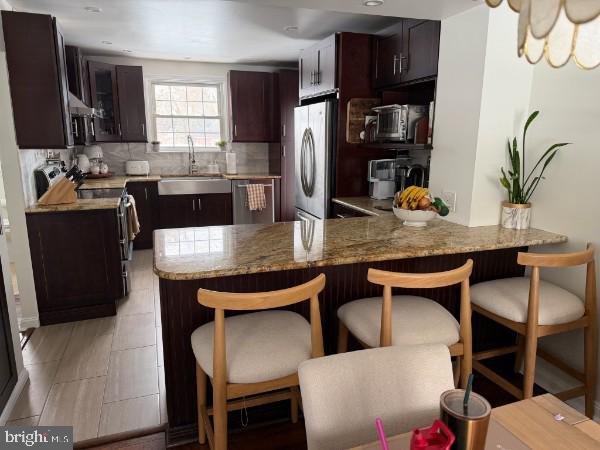 307 Candlewood Road Broomall, PA 19008 - Photo 6 of 18 a view of kitchen and dining area with furniture