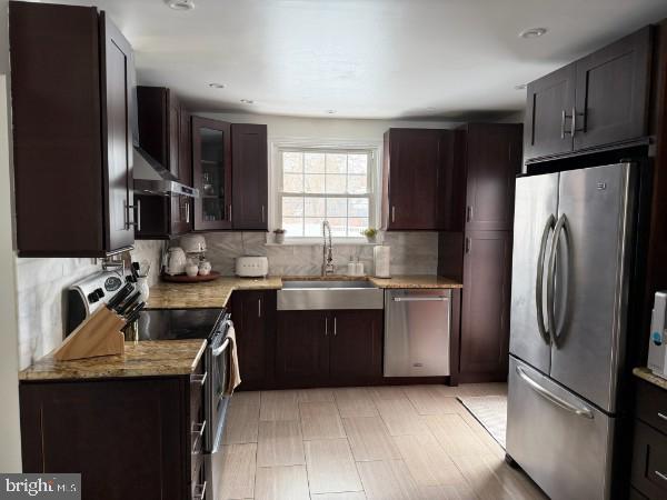 307 Candlewood Road Broomall, PA 19008 - Photo 8 of 18 a kitchen with stainless steel appliances granite countertop a refrigerator stove and sink