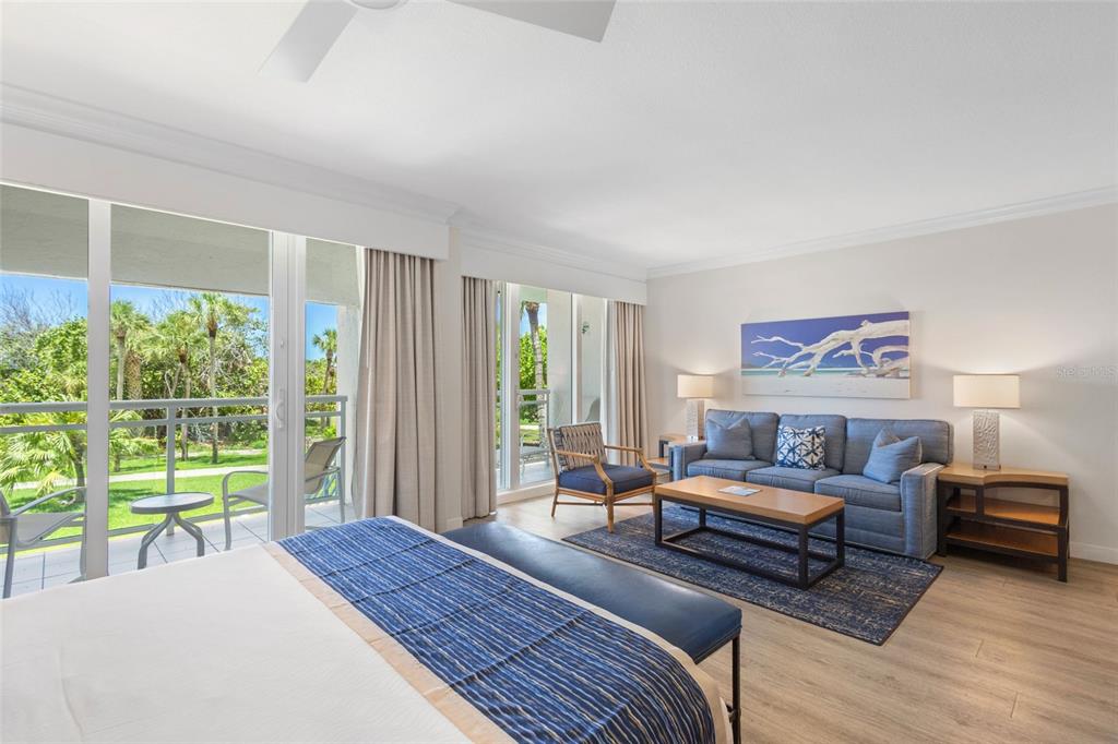 240 Sands Point Road, Unit 4104 Longboat Key, FL 34228 - Photo 8 of 47 a bedroom with furniture and a large window