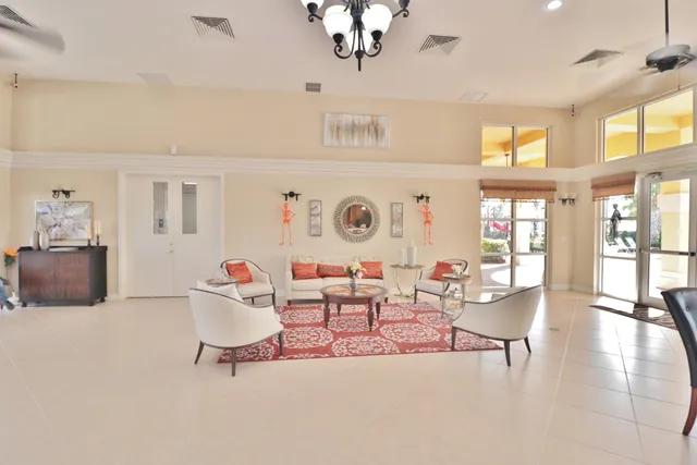 a view of a swimming pool with a dining table and chairs