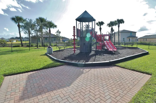 a picture of a room with a bench and a white wall