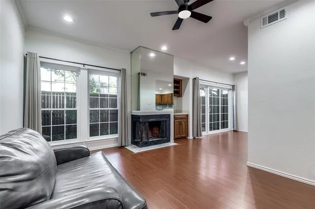 a living room with furniture window and fireplace