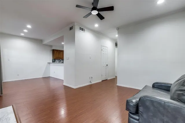 a view of a livingroom with wooden floor