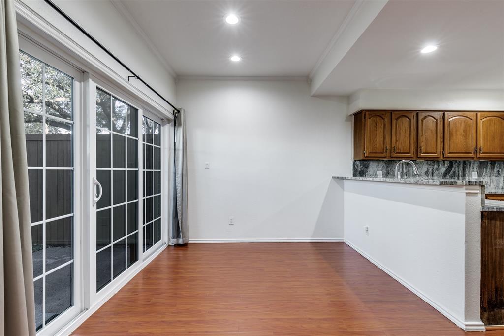 5100 Verde Valley Lane Dallas, TX 75254 - Photo 6 of 12 a view of a kitchen with wooden floor and a window