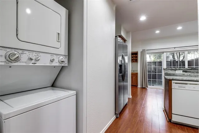 a view of washer and dryer with wooden floor