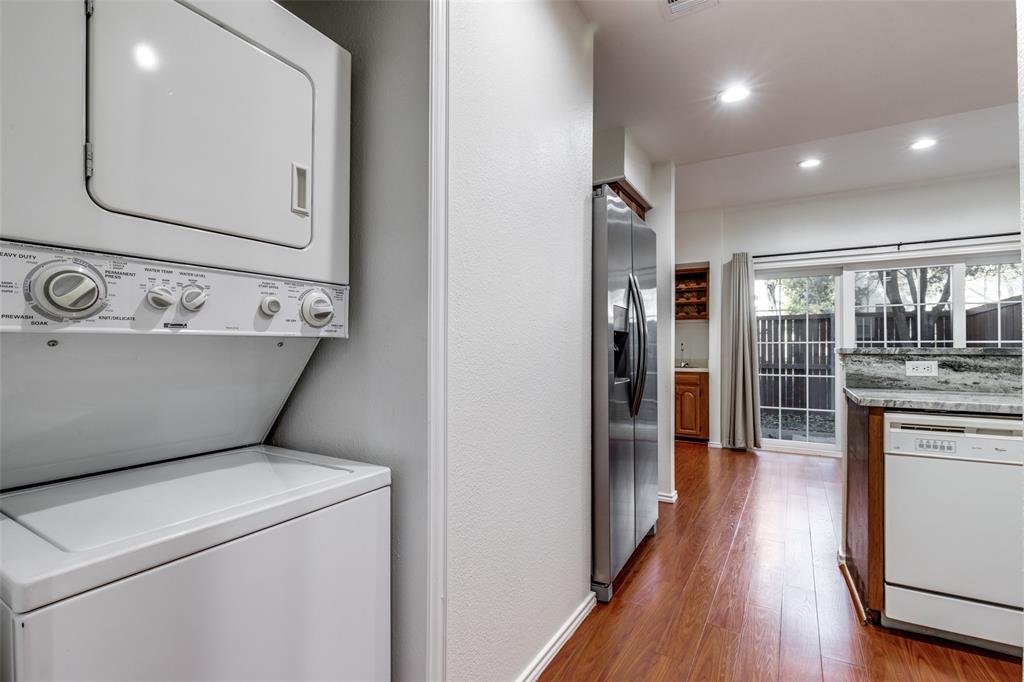 5100 Verde Valley Lane Dallas, TX 75254 - Photo 7 of 12 a view of washer and dryer with wooden floor