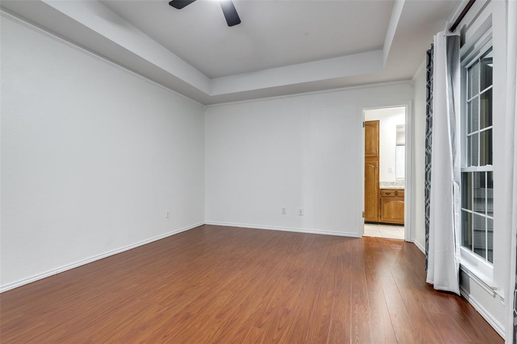 5100 Verde Valley Lane Dallas, TX 75254 - Photo 9 of 12 wooden floor in an empty room with a window