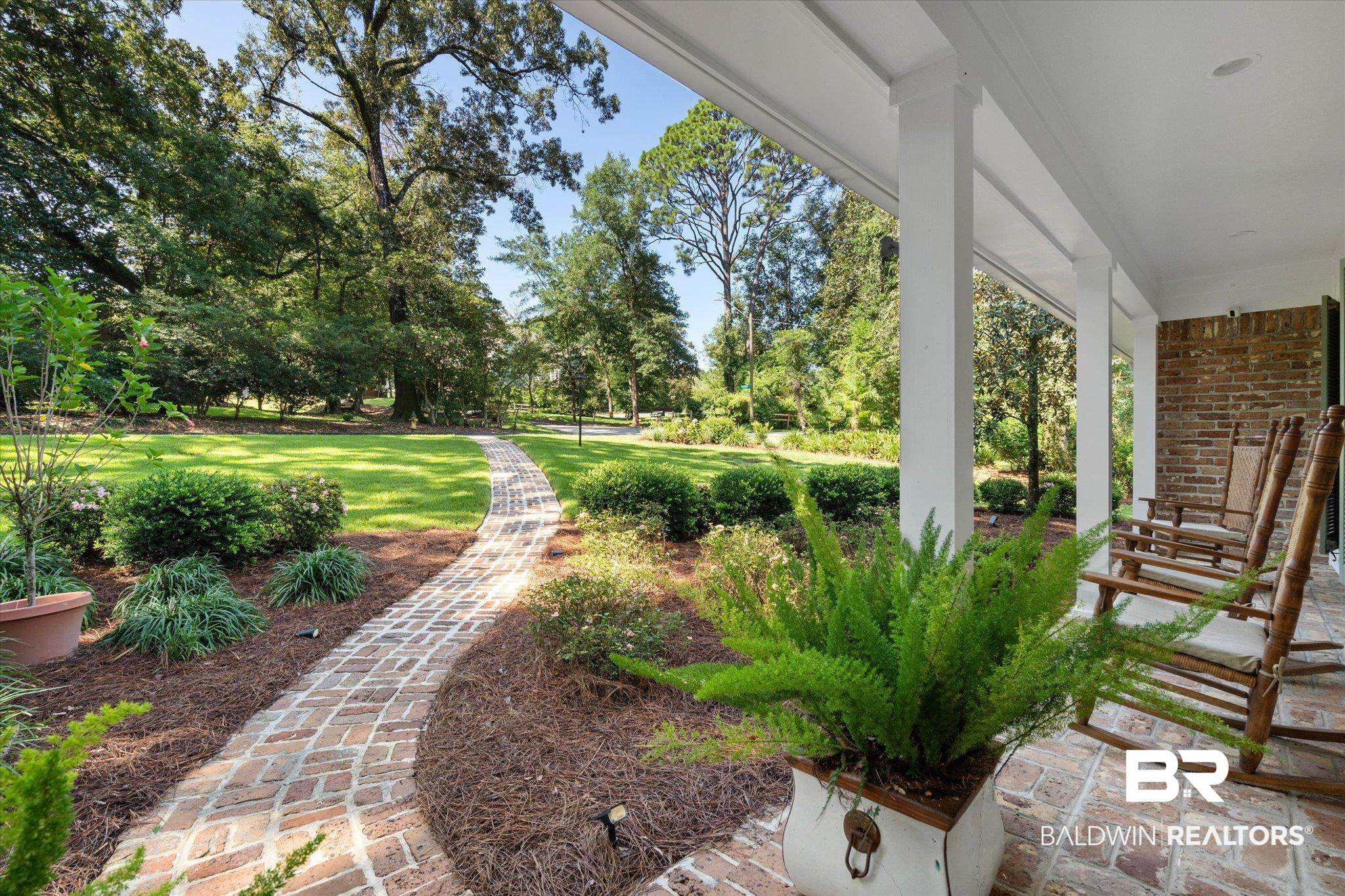 3612 Linden Lane Mobile, AL 36608 - Photo 2 of 42 View of grassy yard with a porch and view of wooded area
