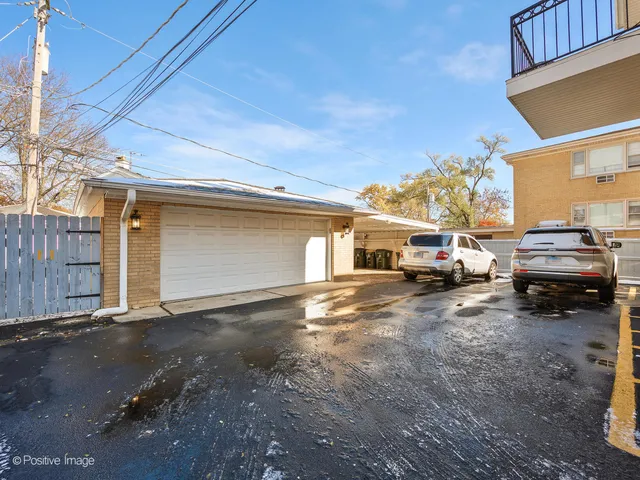 a view of a car park in front of house