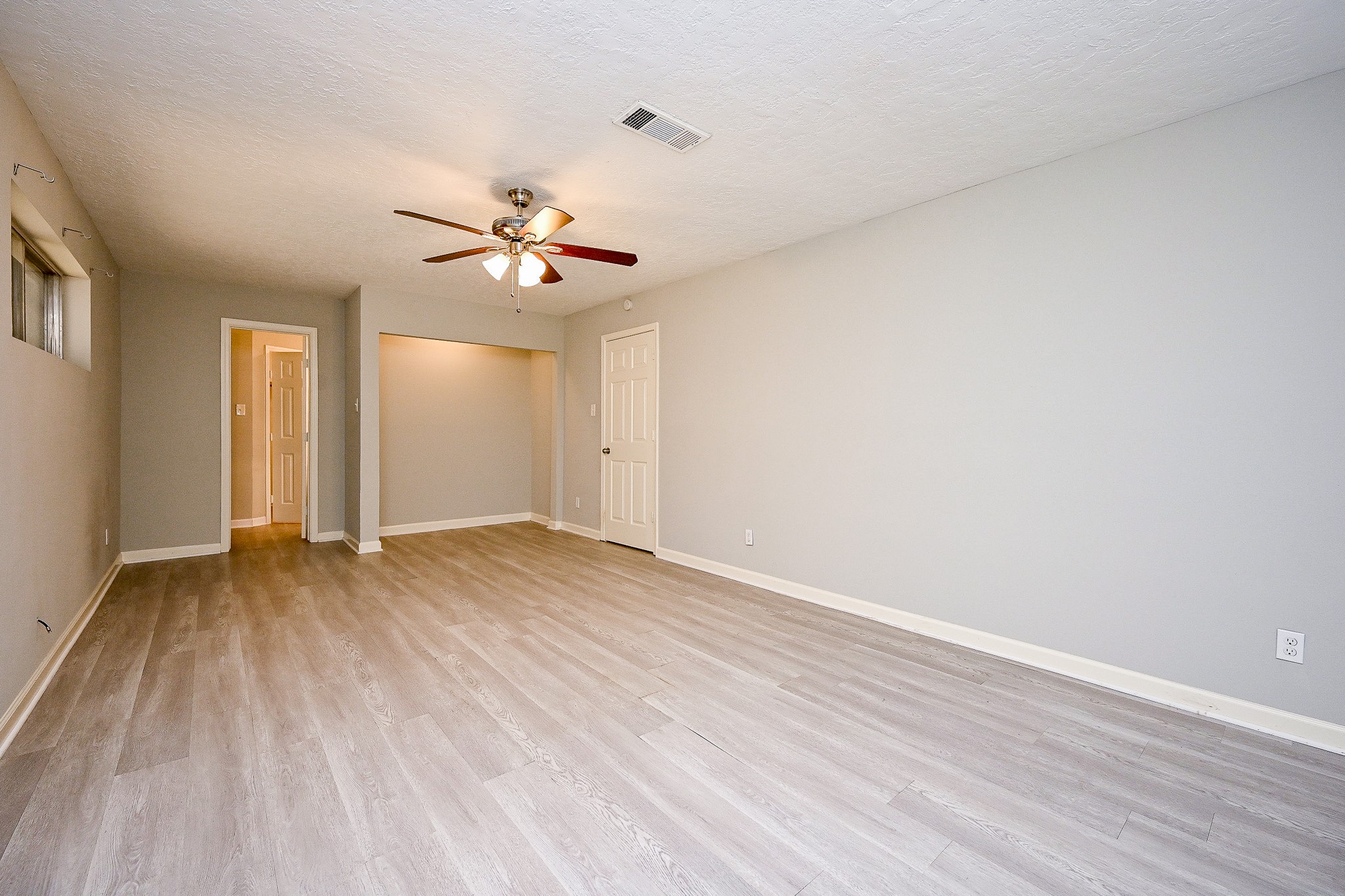 602 Mobile Court Conroe, TX 77302 - Photo 18 of 30 wooden floor in an empty room
