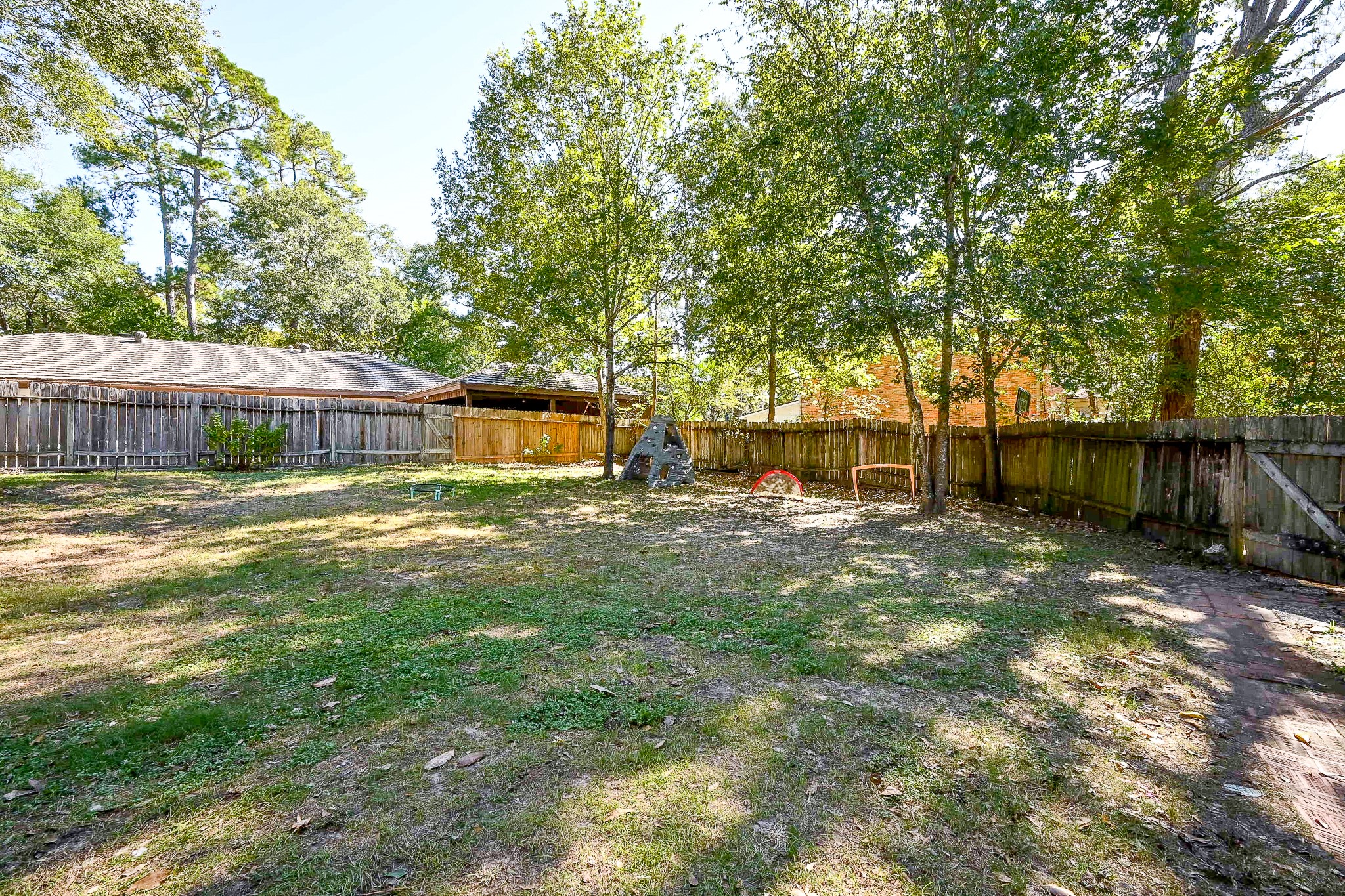 602 Mobile Court Conroe, TX 77302 - Photo 28 of 30 a view of a house with pool and sitting area