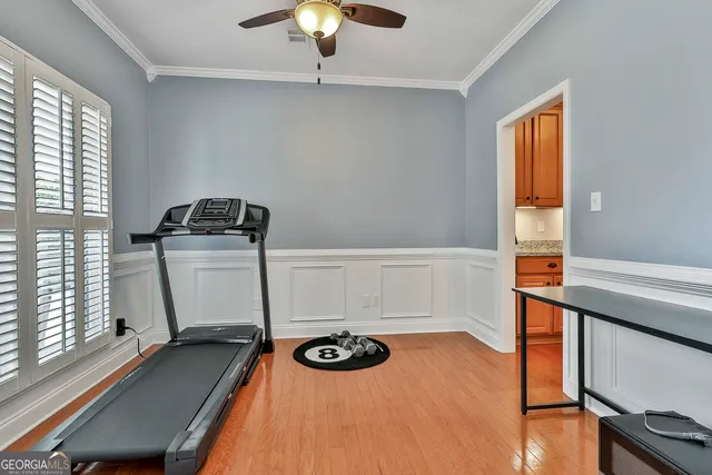 a living room with furniture flat screen tv and a table