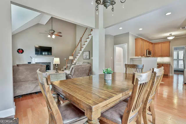 a kitchen with granite countertop a sink and cabinets