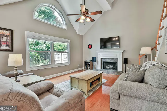 a spacious bedroom with a bed and a chandelier