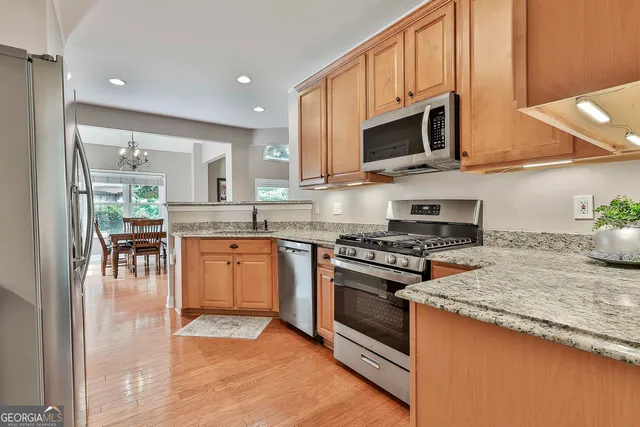 a bathroom with a shower sink and mirror