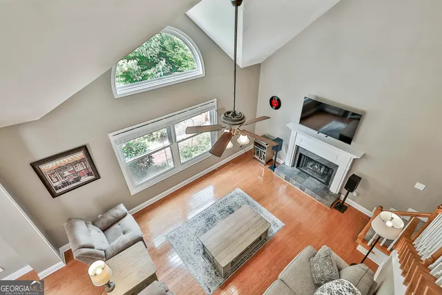 a view of a patio with table and chairs under an umbrella