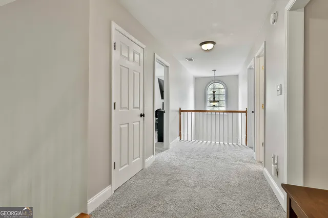 a view of a house with backyard porch and sitting area