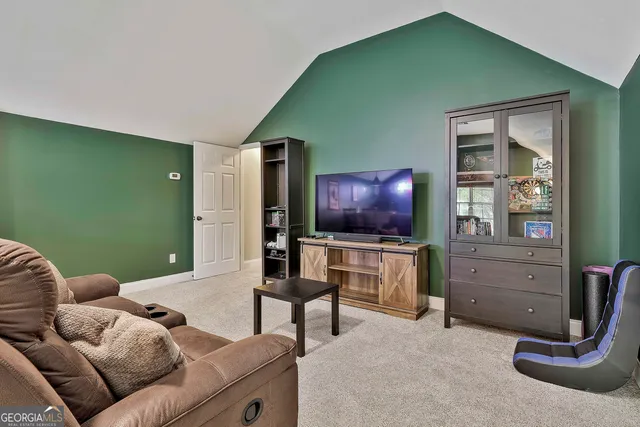 a view of a lake with houses in the back