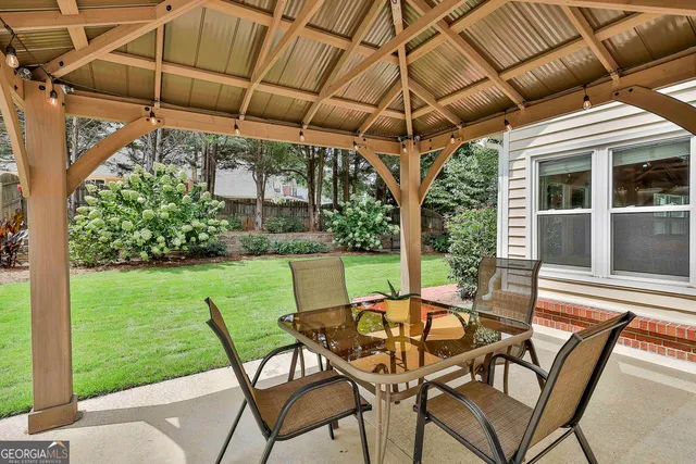 a view of a park with iron fence
