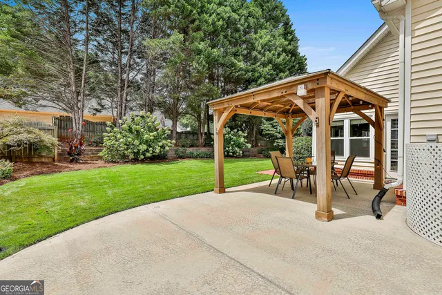 a street sign on a sidewalk next to a road