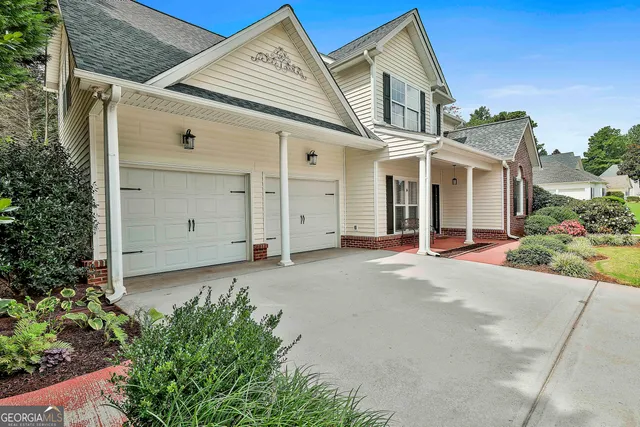 front view of a house with a yard