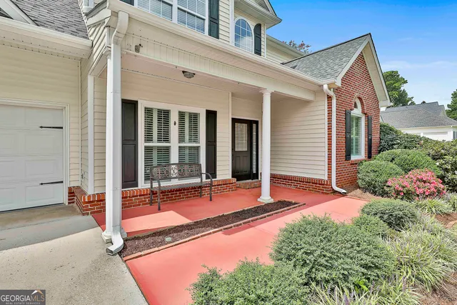 a room with gym equipment and a window